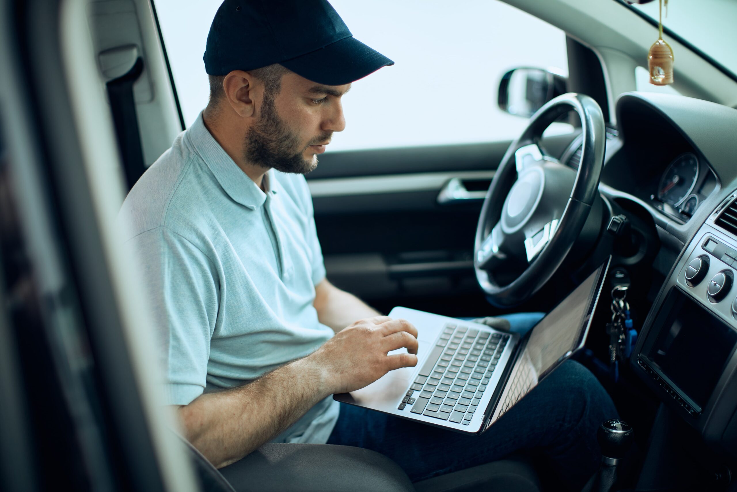 Student taking an online drivers ed course on a laptop in Ottawa, Canada.